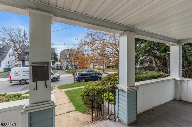 a view of a house with a yard and sitting area