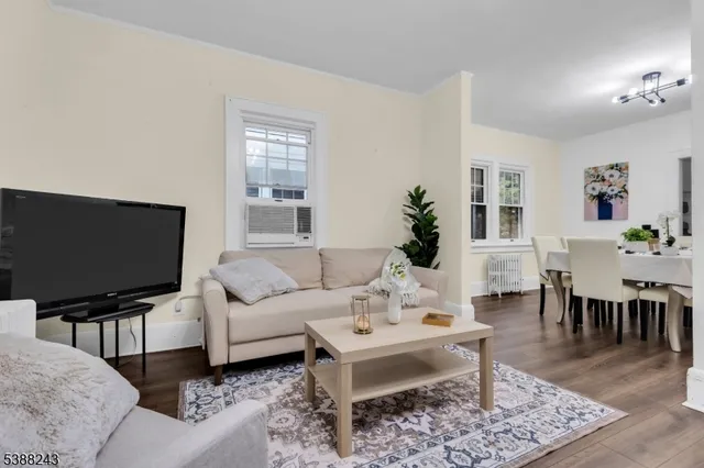 a view of a living room and hardwood floor