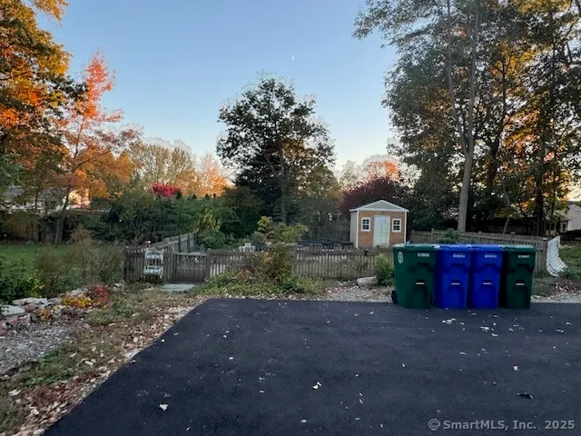 a view of a red house with a yard