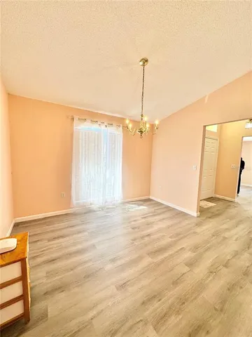 a view of a room with a wooden floor