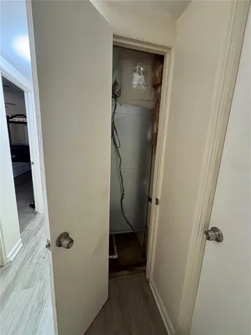 a view of bathroom with a sink and mirror