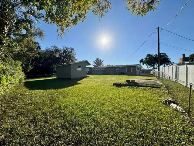 a view of a swimming pool with a table and chairs