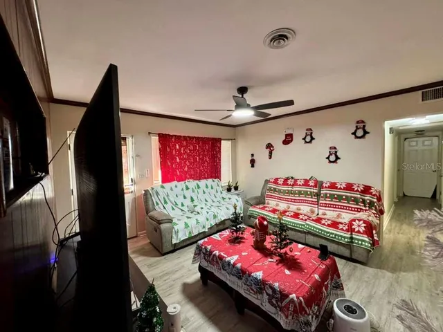 a bedroom with furniture and a baby crib