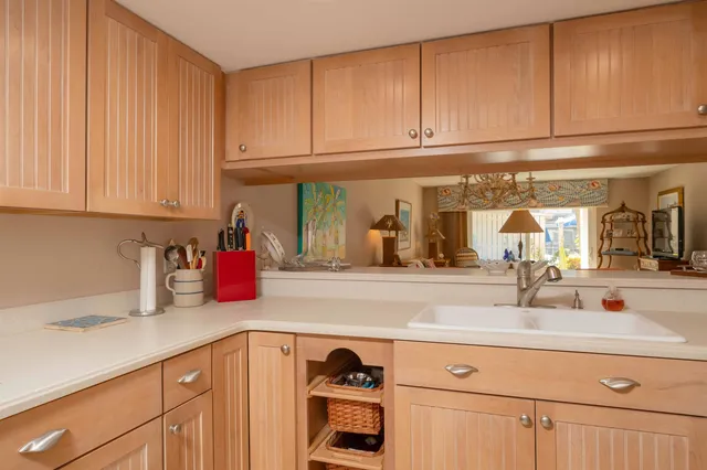 a stove top oven sitting inside of a kitchen