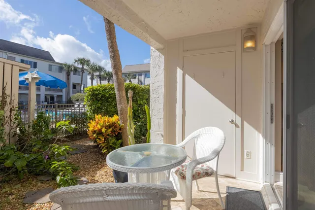a view of swimming pool with seating area