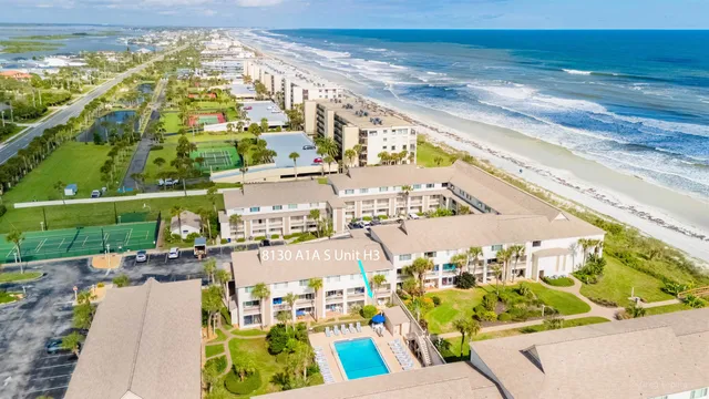 a bedroom with a bed and a table