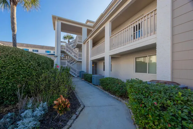 a view of a swimming pool with two chairs