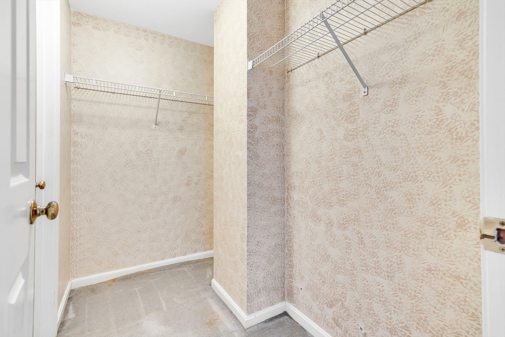 4 Country Meadow Road, Unit 4 Haverhill, MA 01832 - Photo 16 of 29 a bathroom with a glass shower door