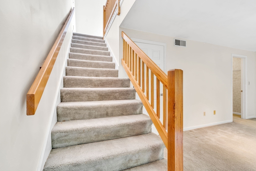 4 Country Meadow Road, Unit 4 Haverhill, MA 01832 - Photo 19 of 29 a view of staircase with wooden floor and white walls