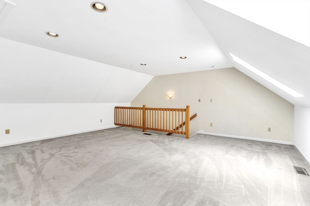 4 Country Meadow Road, Unit 4 Haverhill, MA 01832 - Photo 21 of 29 an empty room with a ceiling fan and window