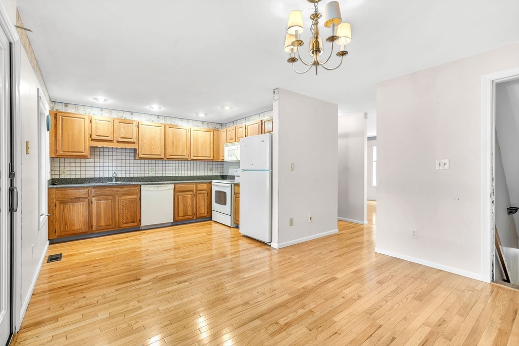 4 Country Meadow Road, Unit 4 Haverhill, MA 01832 - Photo 5 of 29 a view of a kitchen with a sink and cabinets