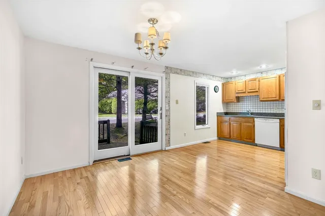 a view of a kitchen with a sink and cabinet area