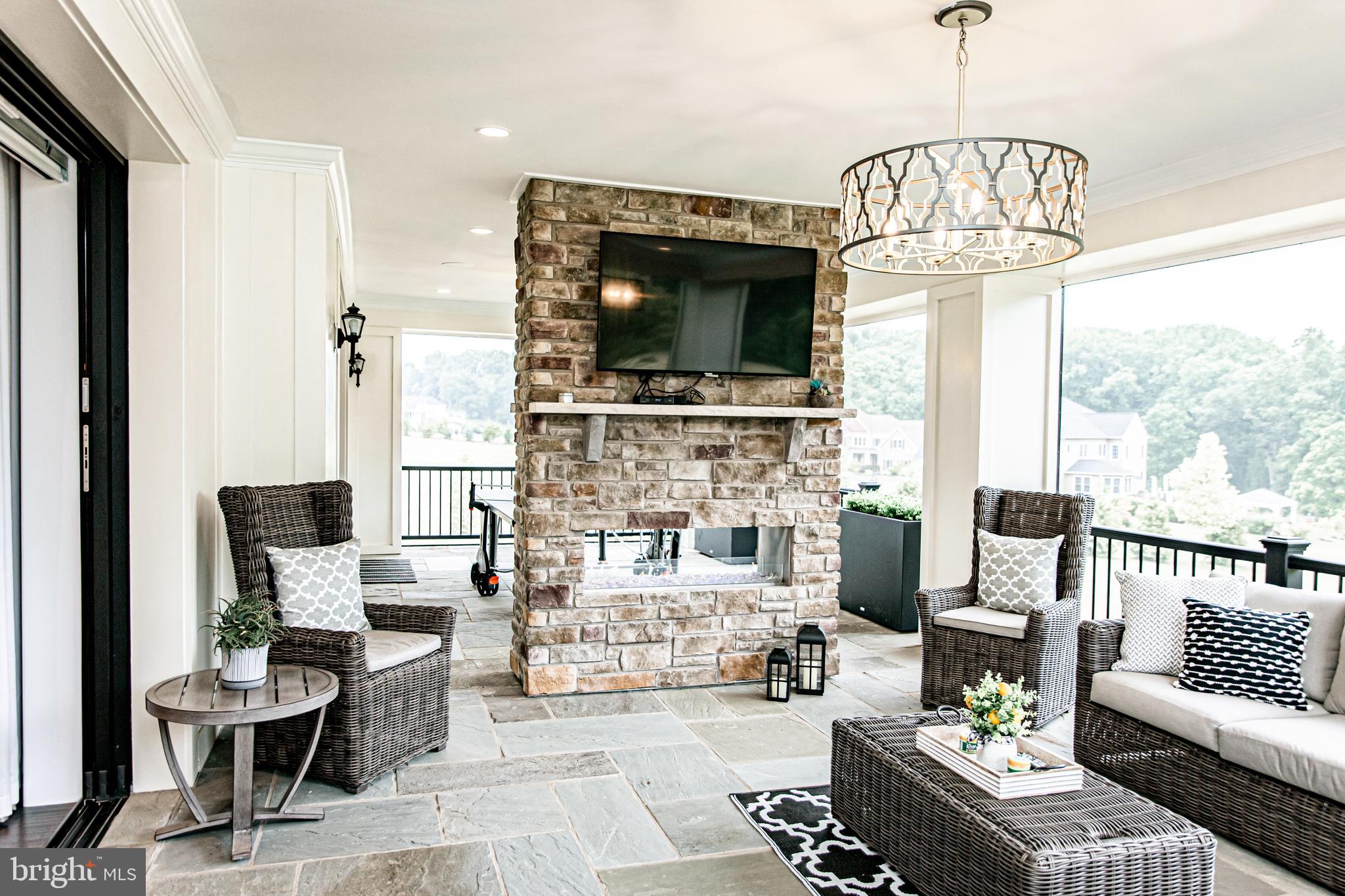 14430 Maple Ridge Court Baldwin, MD 21013 - Photo 11 of 35 Stone fireplace in outdoor living area