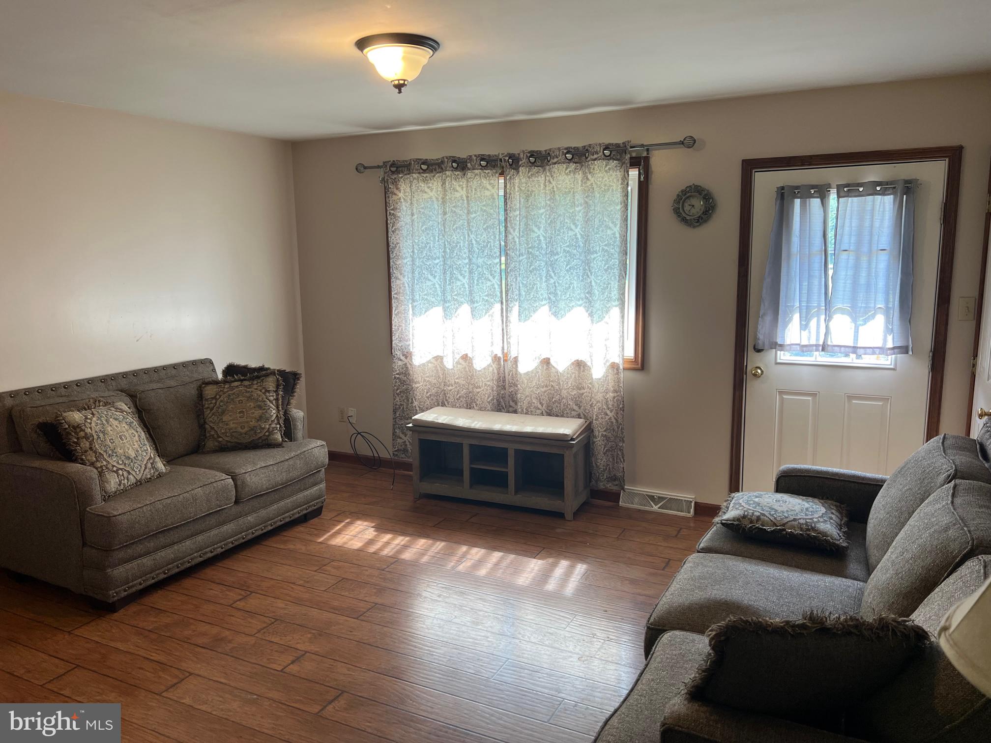 303 Grant Road Adamstown, PA 17569 - Photo 5 of 13 a living room with furniture and a window