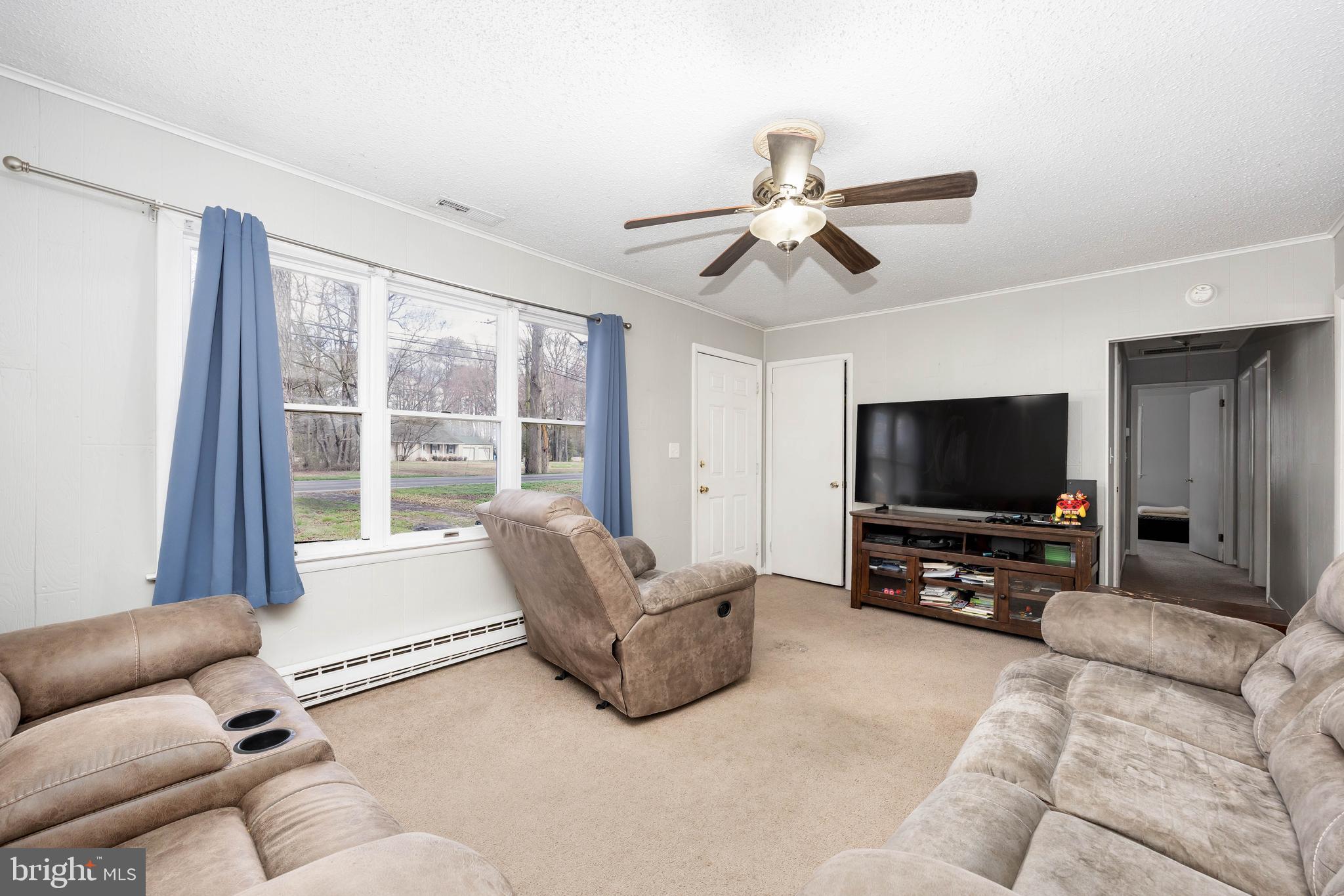 6870 Zion Church Road Salisbury, MD 21804 - Photo 11 of 39 a living room with furniture and a flat screen tv