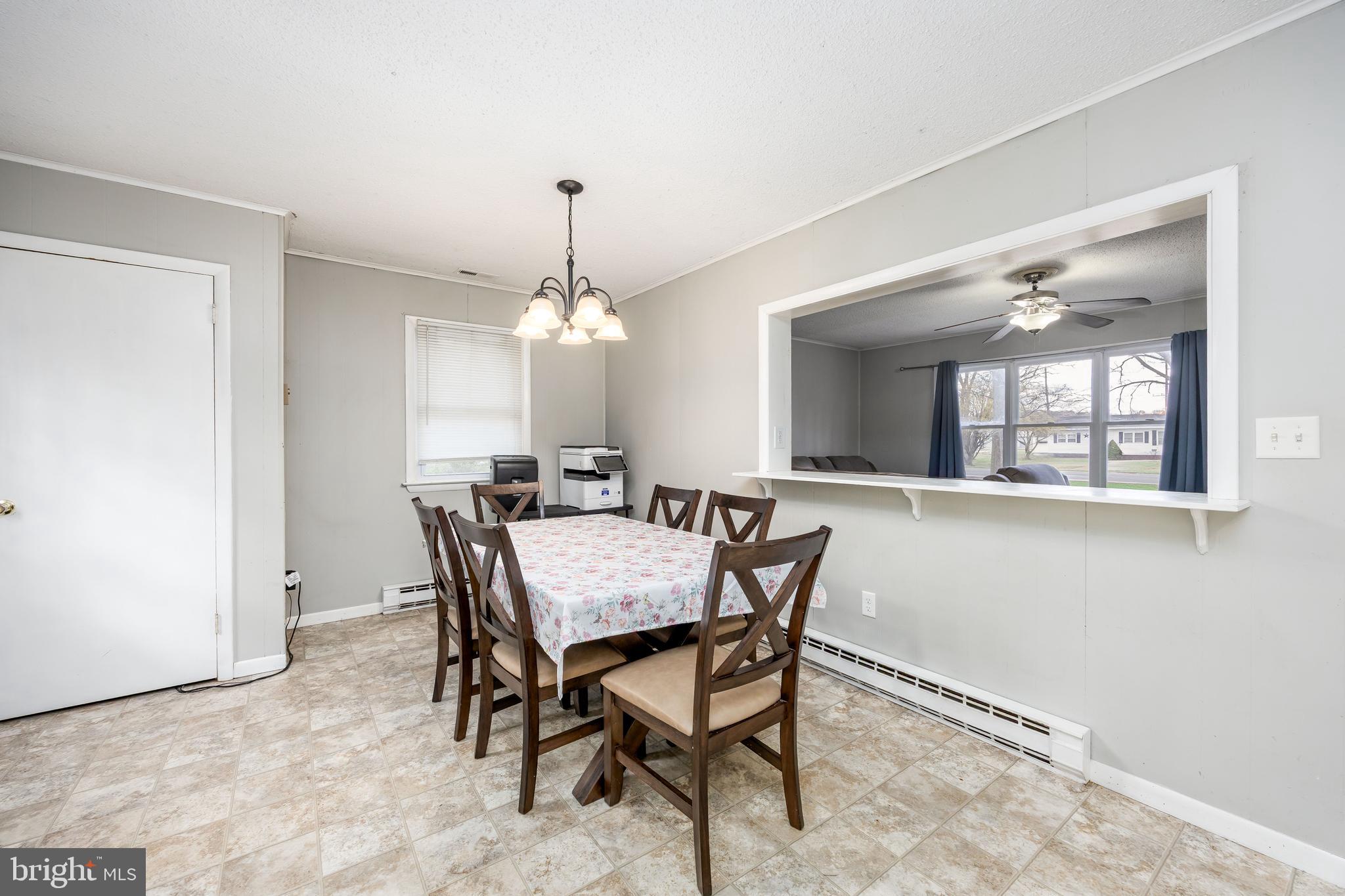 6870 Zion Church Road Salisbury, MD 21804 - Photo 15 of 39 a view of a dining room with furniture and chandelier