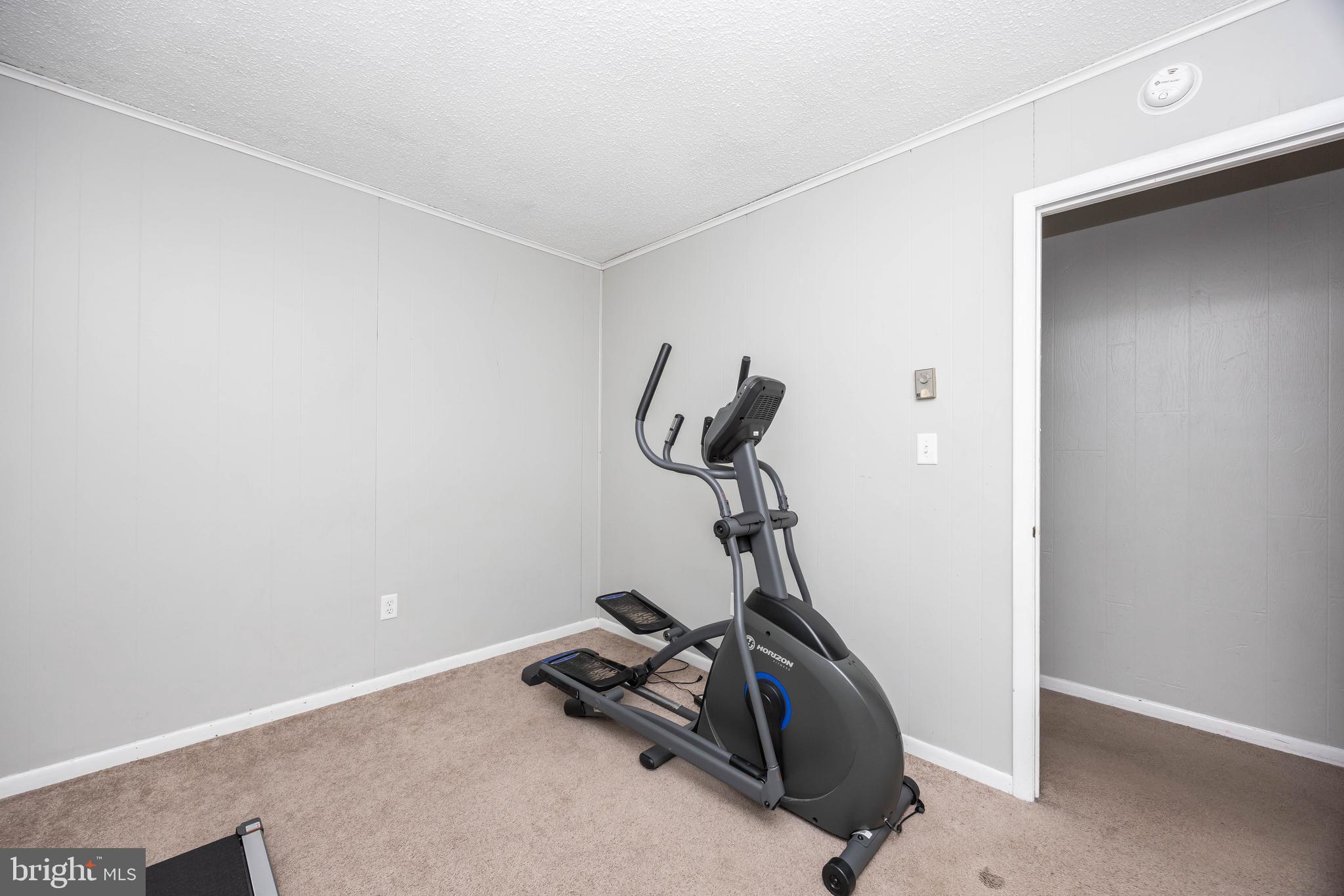 6870 Zion Church Road Salisbury, MD 21804 - Photo 21 of 39 a room with gym equipment and view of a room