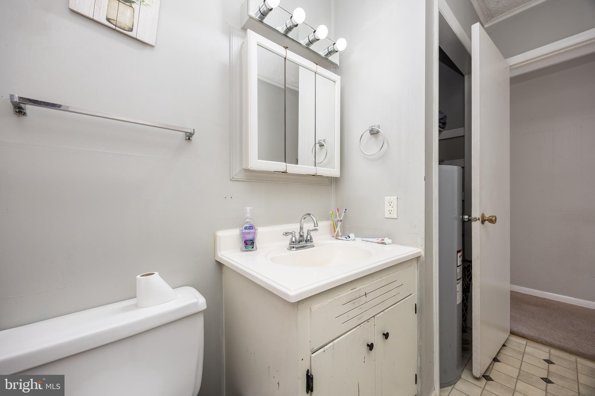 6870 Zion Church Road Salisbury, MD 21804 - Photo 24 of 39 a bathroom with a sink toilet and vanity