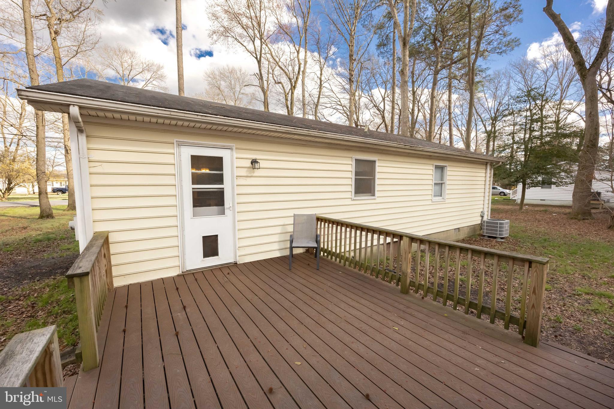 6870 Zion Church Road Salisbury, MD 21804 - Photo 35 of 39 a view of a wooden deck with a yard
