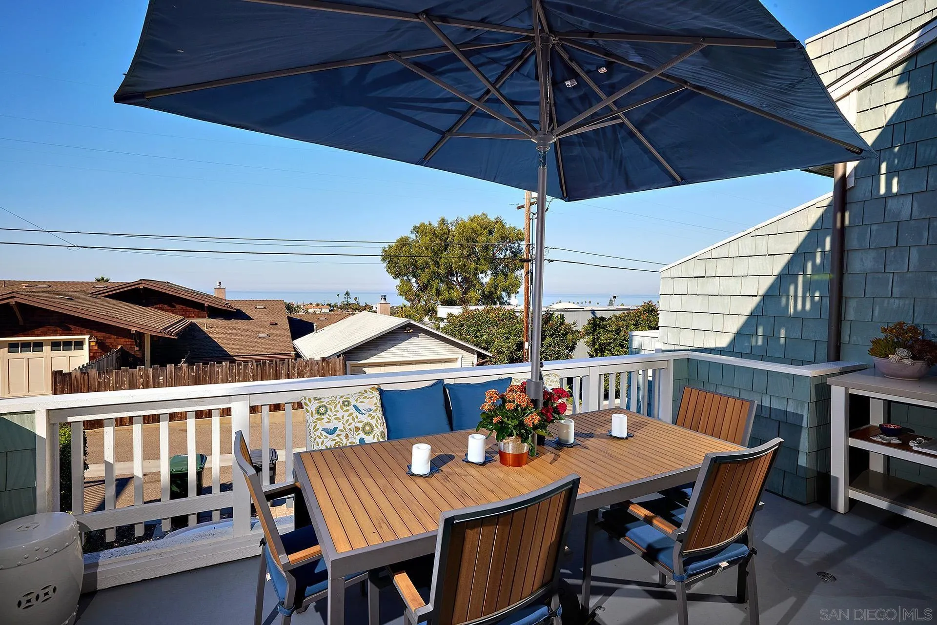 744 Cornish Drive Encinitas, CA 92024 - Photo 7 of 39 a view of a patio with a table and chairs under an umbrella