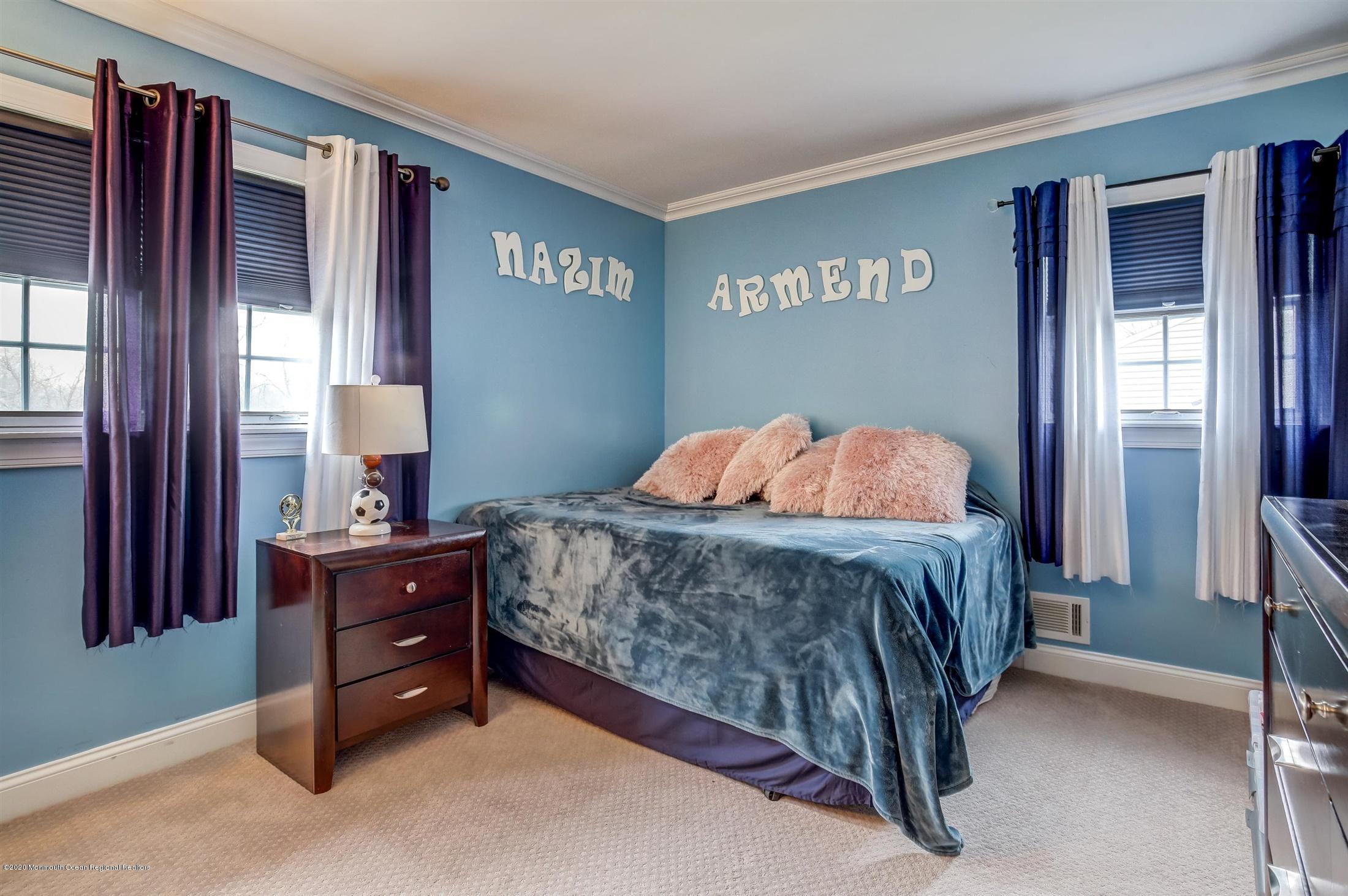 4 Wickatunk Road Manalapan, NJ 07726 - Photo 14 of 23 a bedroom with a bed and window