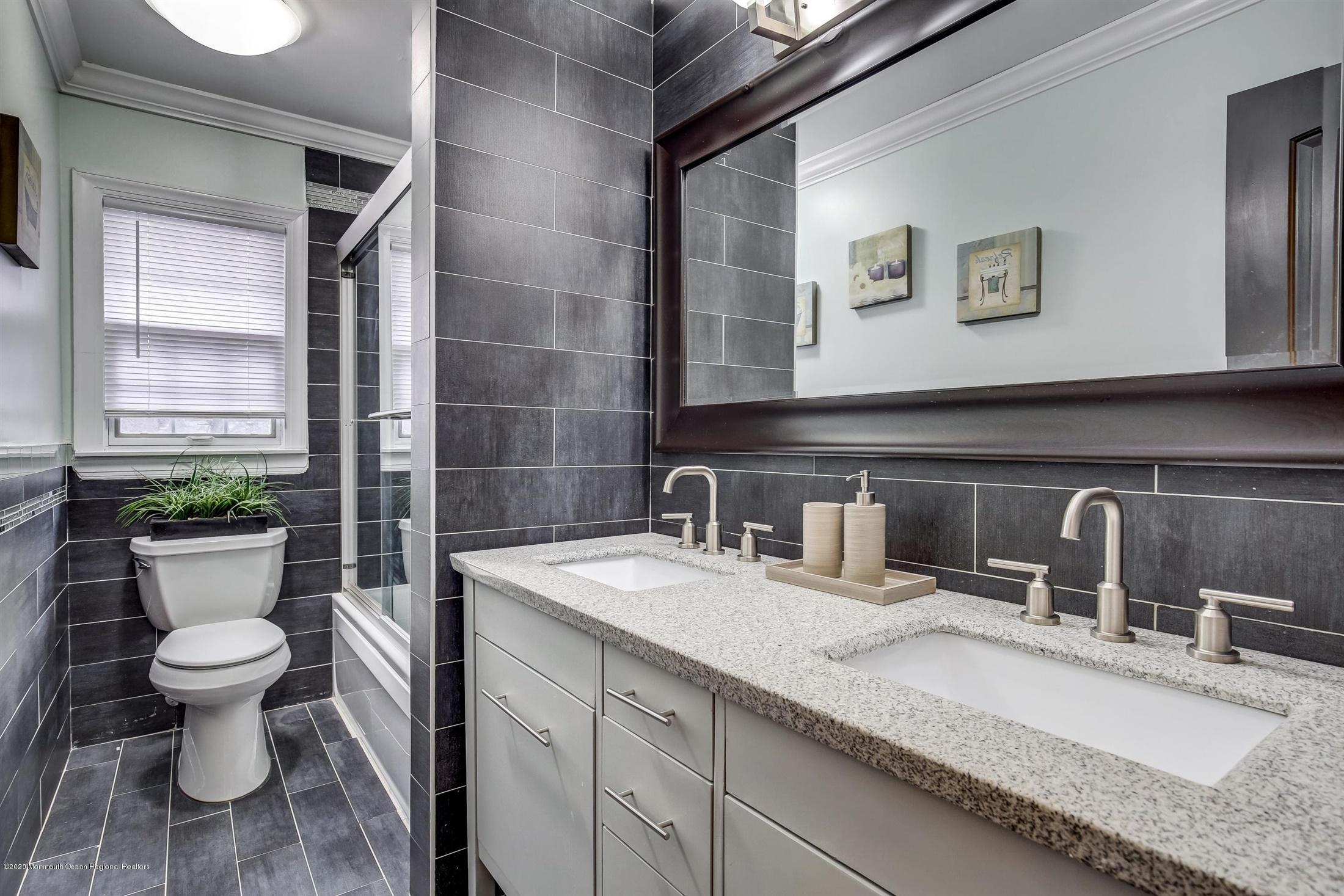 4 Wickatunk Road Manalapan, NJ 07726 - Photo 15 of 23 a bathroom with a granite countertop sink mirror and toilet
