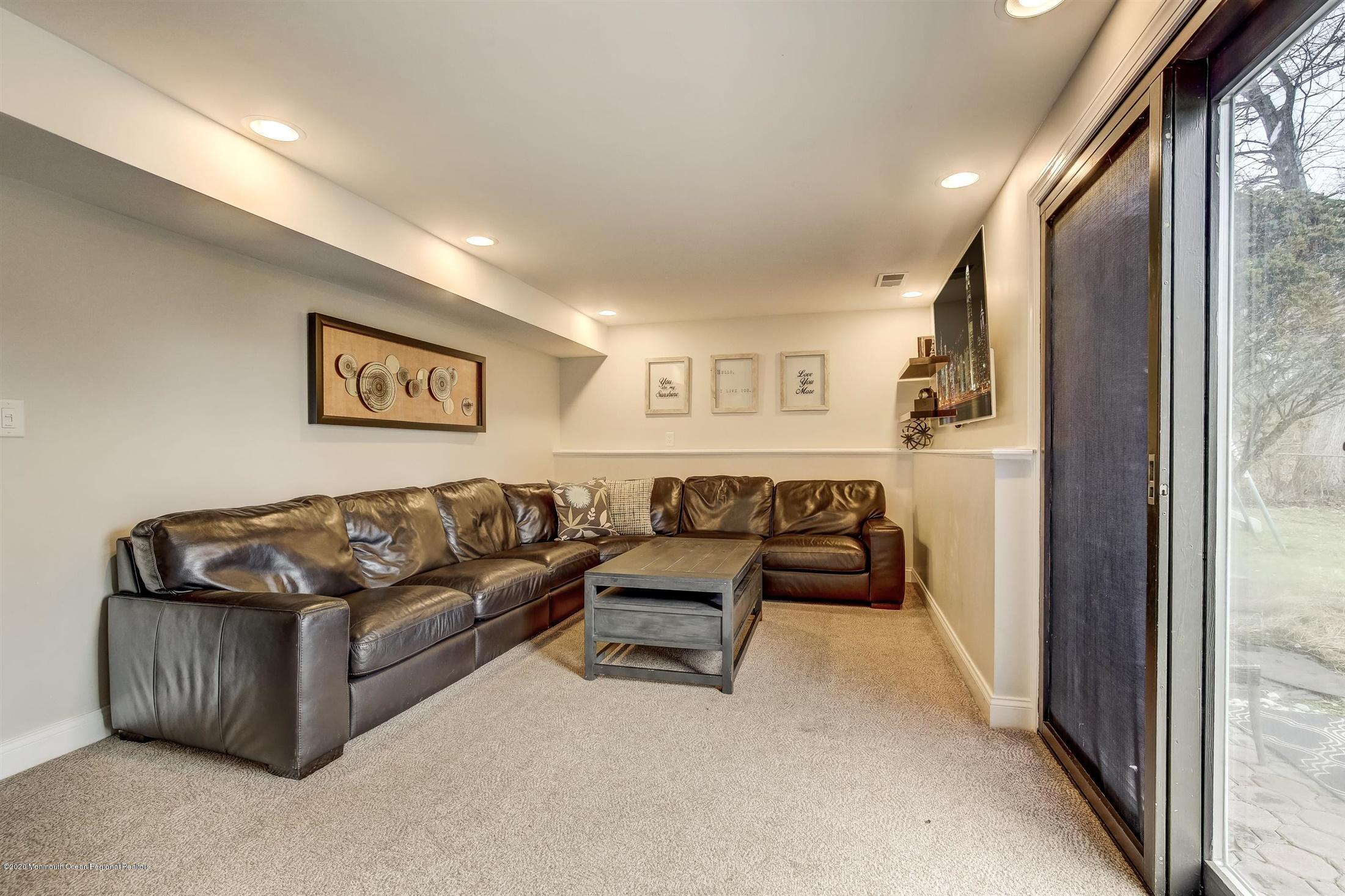 4 Wickatunk Road Manalapan, NJ 07726 - Photo 18 of 23 a living room with furniture and a window