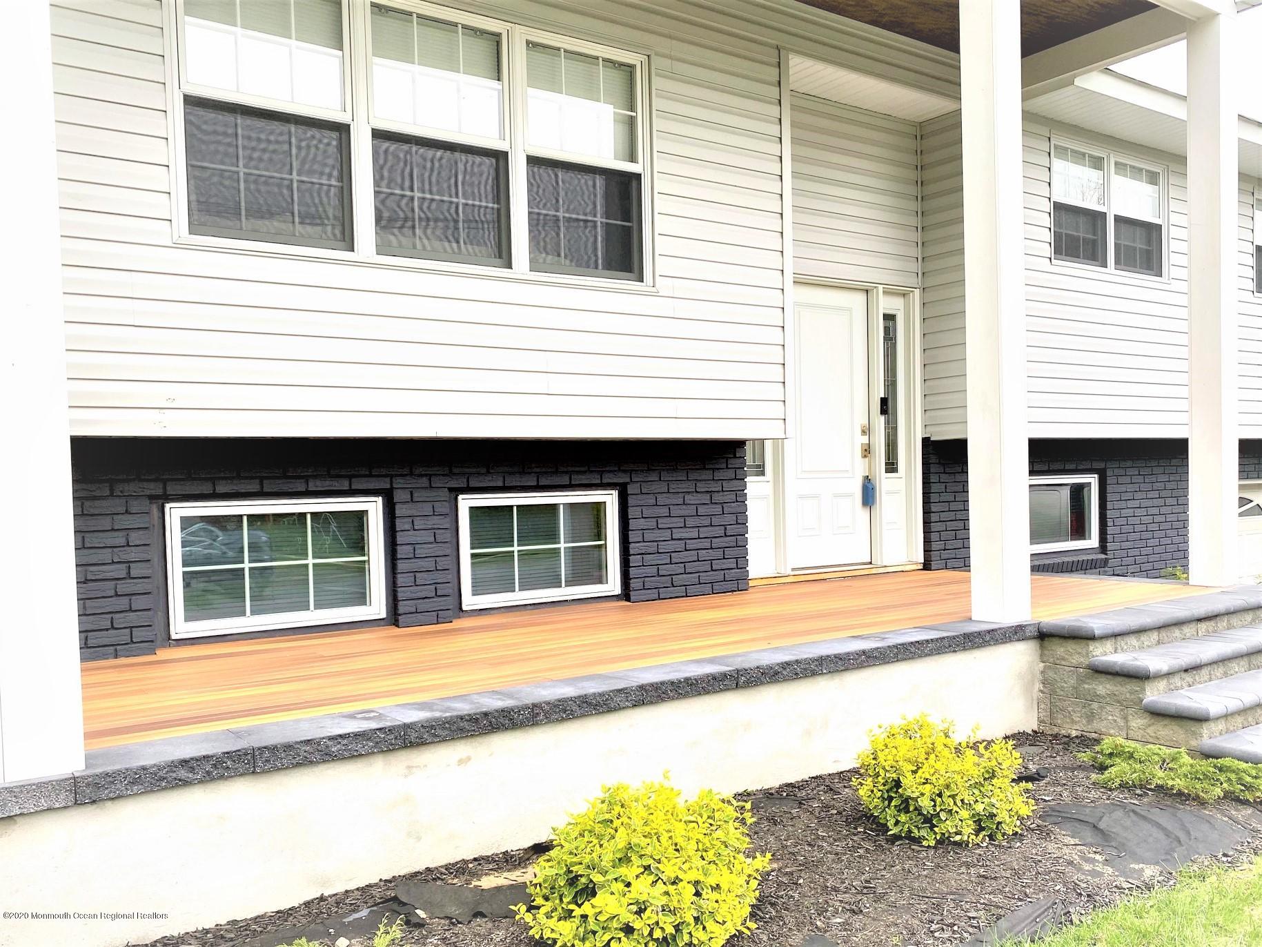 4 Wickatunk Road Manalapan, NJ 07726 - Photo 5 of 23 a view of a house with a window and sitting area