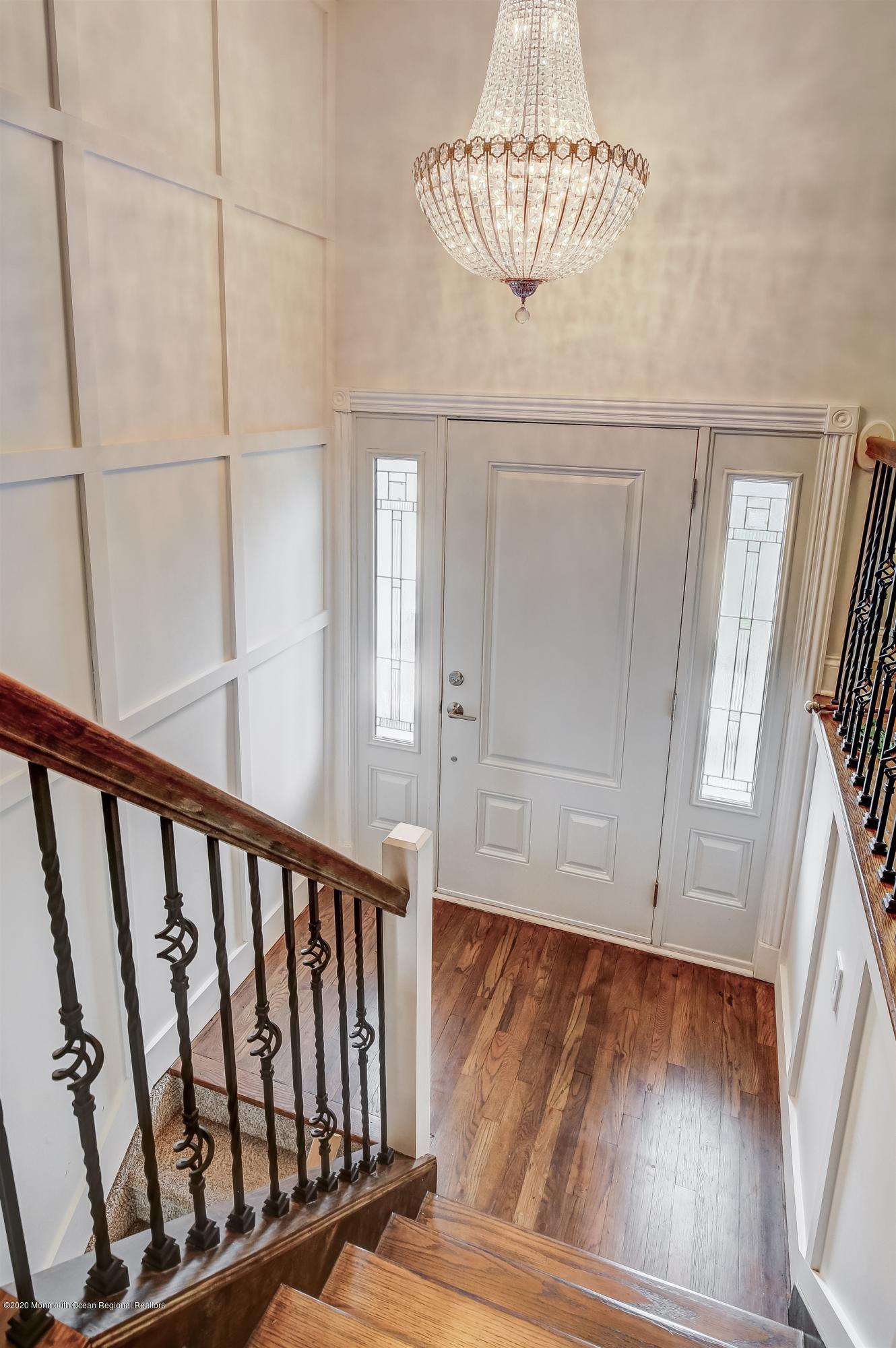 4 Wickatunk Road Manalapan, NJ 07726 - Photo 6 of 23 a view of entryway with wooden floor