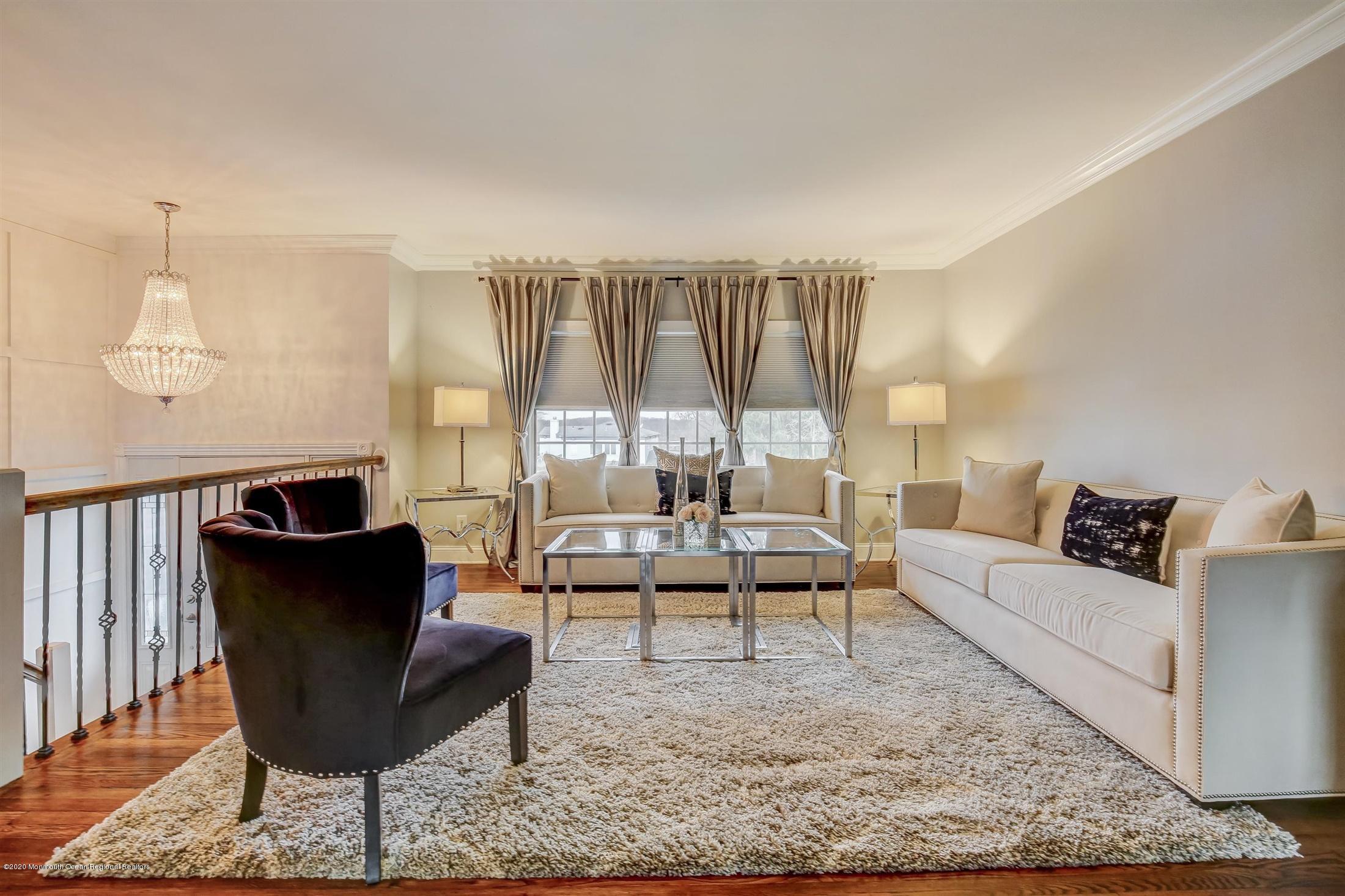 4 Wickatunk Road Manalapan, NJ 07726 - Photo 8 of 23 a living room with furniture and a large window
