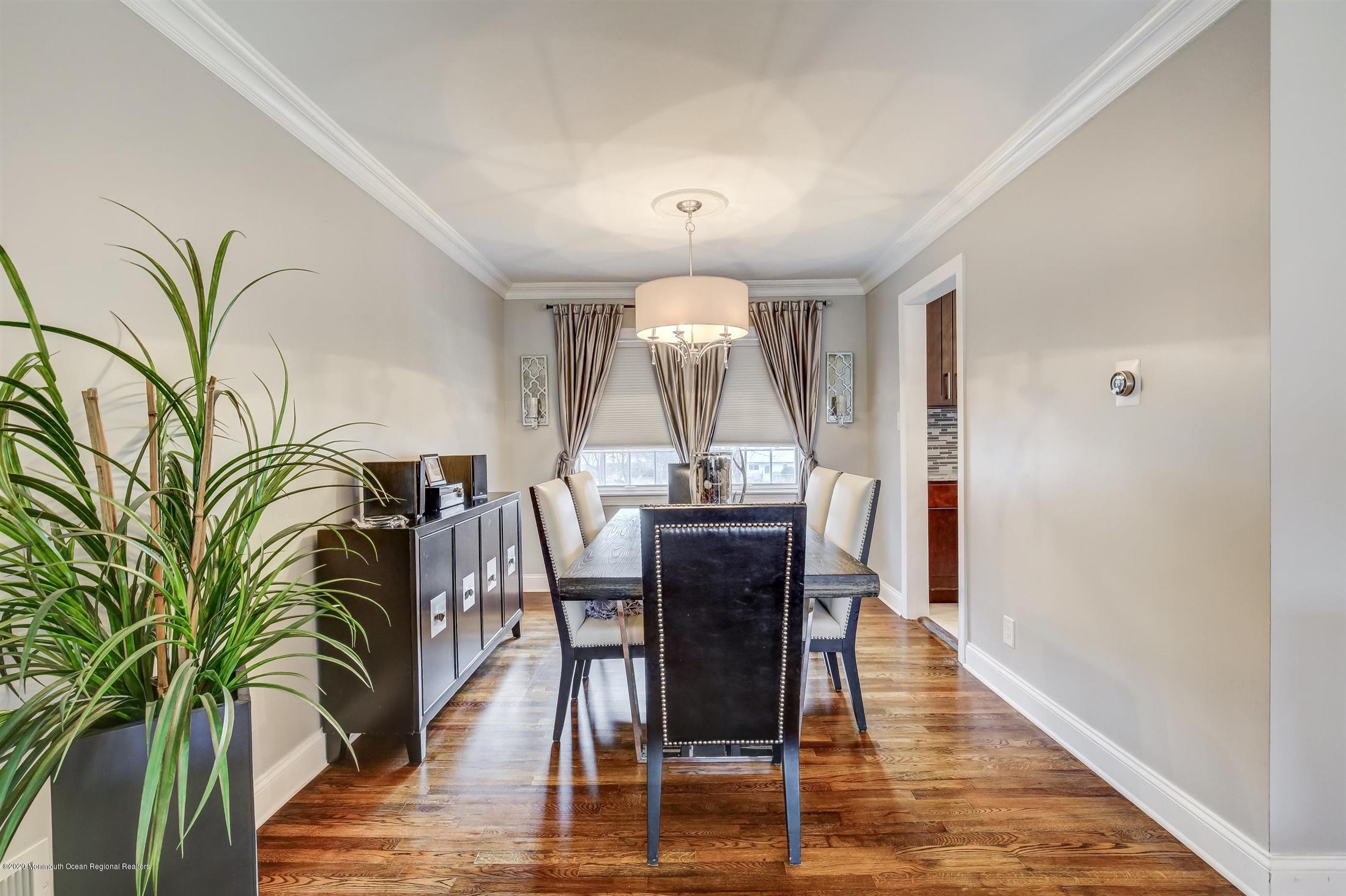 4 Wickatunk Road Manalapan, NJ 07726 - Photo 9 of 23 a view of a dining room with furniture and wooden floor