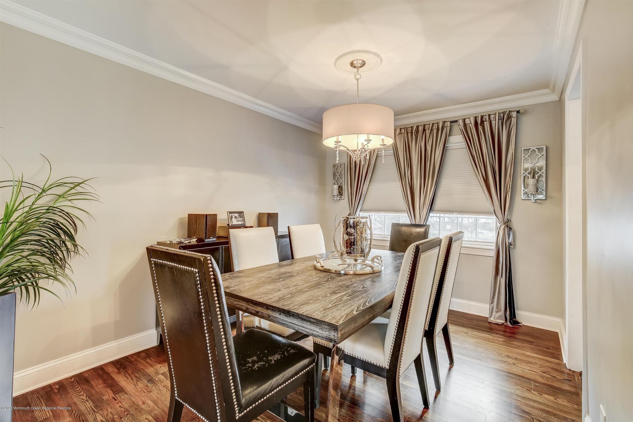 4 Wickatunk Road Manalapan, NJ 07726 - Photo 10 of 23 a view of a dining room with furniture window and wooden floor