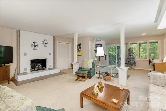 a bedroom with a large bed and wooden floor