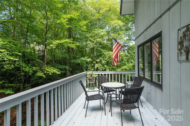 a view of balcony with deck and outdoor seating