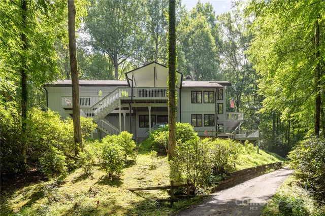 a house with swimming pool in front of it