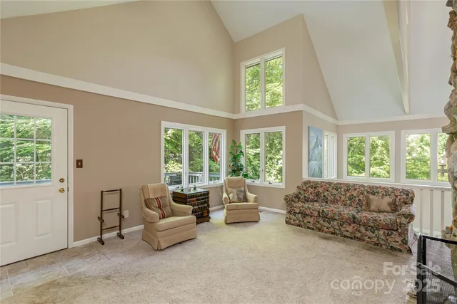 a kitchen with a table chairs and a refrigerator