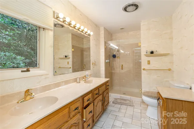 a view of a livingroom with furniture and a window