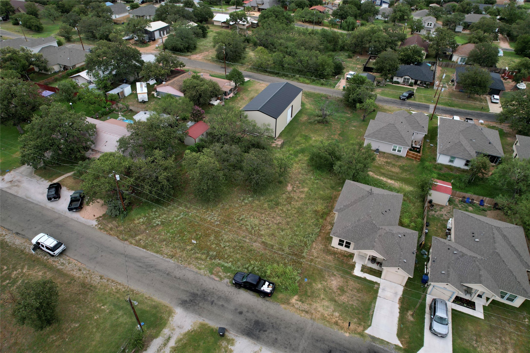 an aerial view of residential house with outdoor space and street view