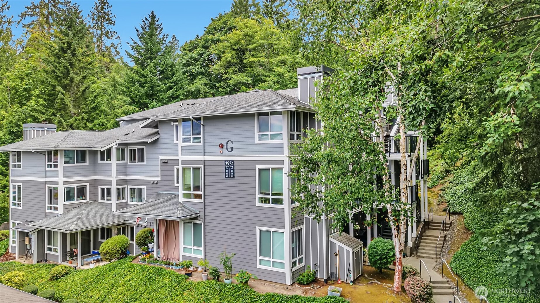 a front view of a house with a garden
