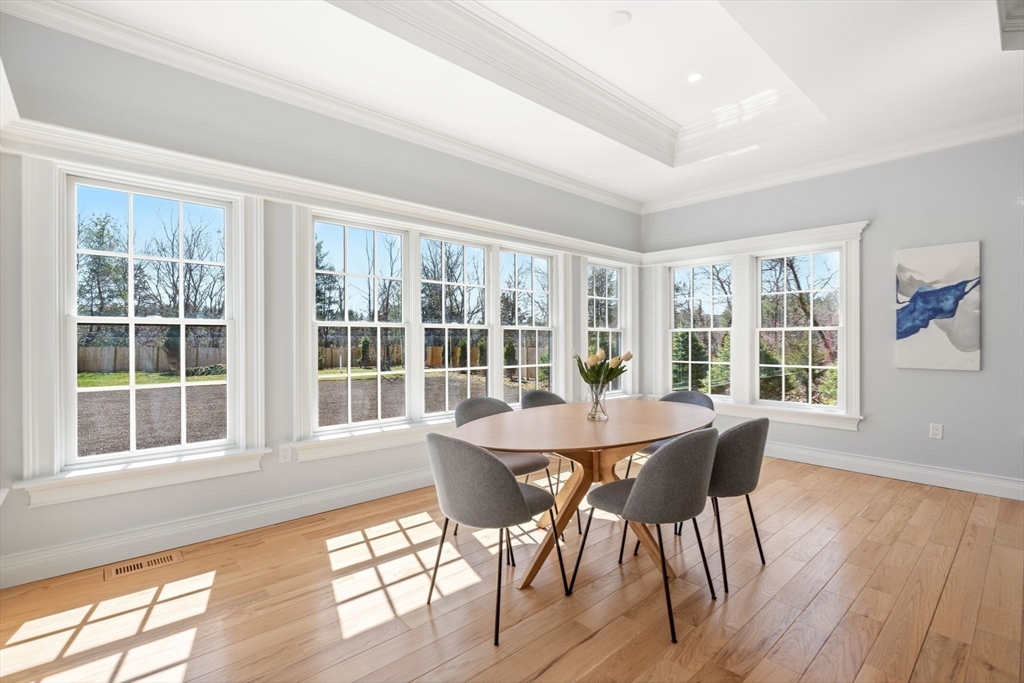 10 Hitching Post Lane Weston, MA 02493 - Photo 11 of 42 a view of a dining room with furniture window and wooden floor