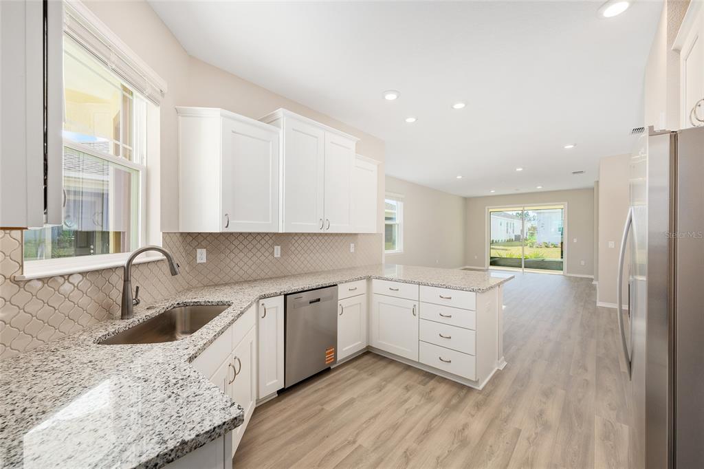 7288 Southwest 89th Avenue Ocala, FL 34481 - Photo 18 of 34 a kitchen with a sink cabinets and window