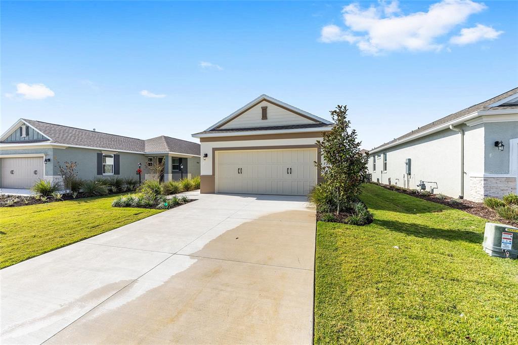 7288 Southwest 89th Avenue Ocala, FL 34481 - Photo 2 of 34 a front view of a house with garden