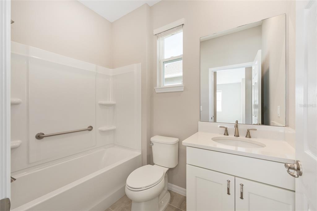 7288 Southwest 89th Avenue Ocala, FL 34481 - Photo 26 of 34 a bathroom with a sink toilet and shower