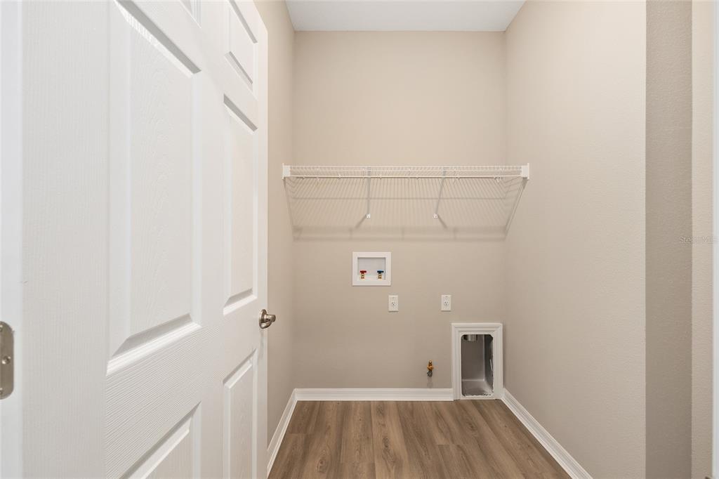 7288 Southwest 89th Avenue Ocala, FL 34481 - Photo 27 of 34 a view of a room with wooden floor