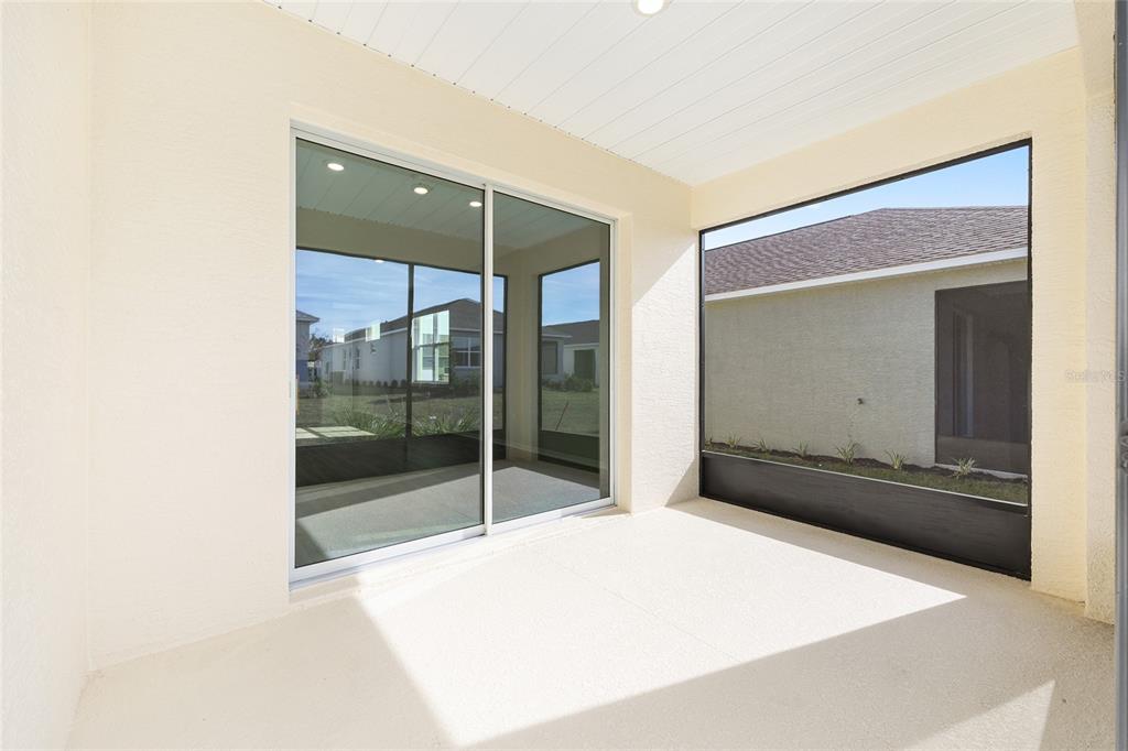 7288 Southwest 89th Avenue Ocala, FL 34481 - Photo 31 of 34 a bedroom with a bed and a mirror