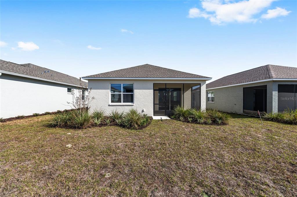 7288 Southwest 89th Avenue Ocala, FL 34481 - Photo 33 of 34 a front view of a house with garden
