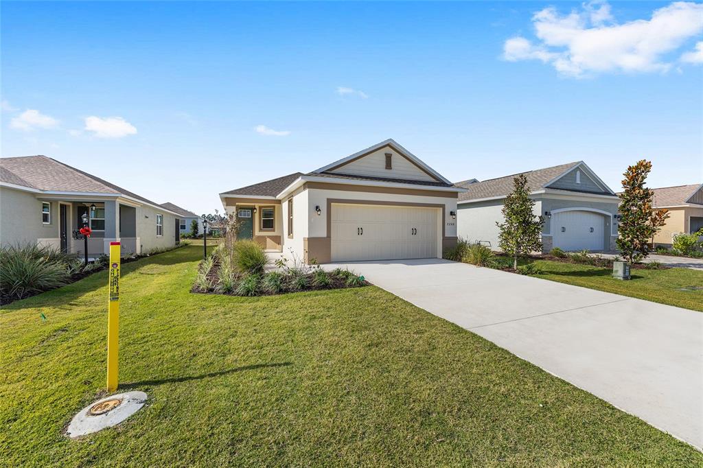 7288 Southwest 89th Avenue Ocala, FL 34481 - Photo 4 of 34 a view of a house with a yard