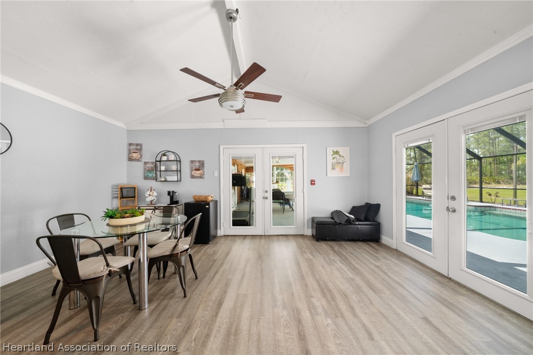5731 Wolf Lake Road Sebring, FL 33875 - Photo 12 of 45 a view of a livingroom with furniture window and wooden floor