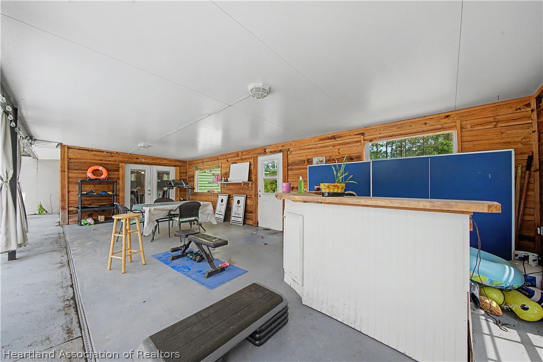 5731 Wolf Lake Road Sebring, FL 33875 - Photo 16 of 45 a room with furniture and a view of living room