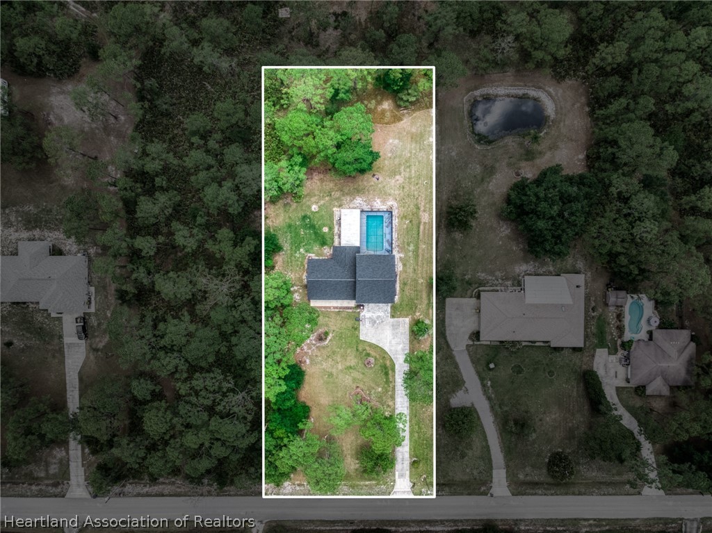 5731 Wolf Lake Road Sebring, FL 33875 - Photo 2 of 45 an aerial view of a house
